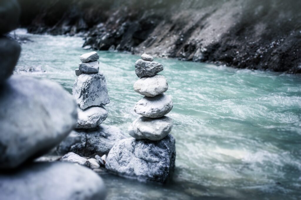 JLNich Author Blog Beats Article: A Writer’s Keystone Habits image of river with stacked rocks