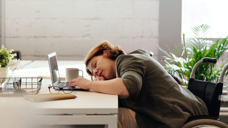 JLNICH blog beats article, The Demand of NaNoWriMo: Inspiration from the Writing Trenches. image of woman sleeping at computer