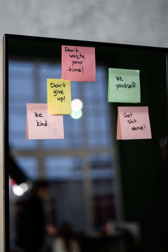JL NICH blog beats article, Year-End Review of 2023. Mirror with motivational sticky notes. don't give up, be kind to yourself.