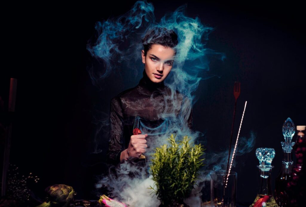 JL NICH blog beats article, SFF Writing Resolutions for the Future: 3-Year and 5-Year. Woman with plants and smoke mixing stuff together, alchemists